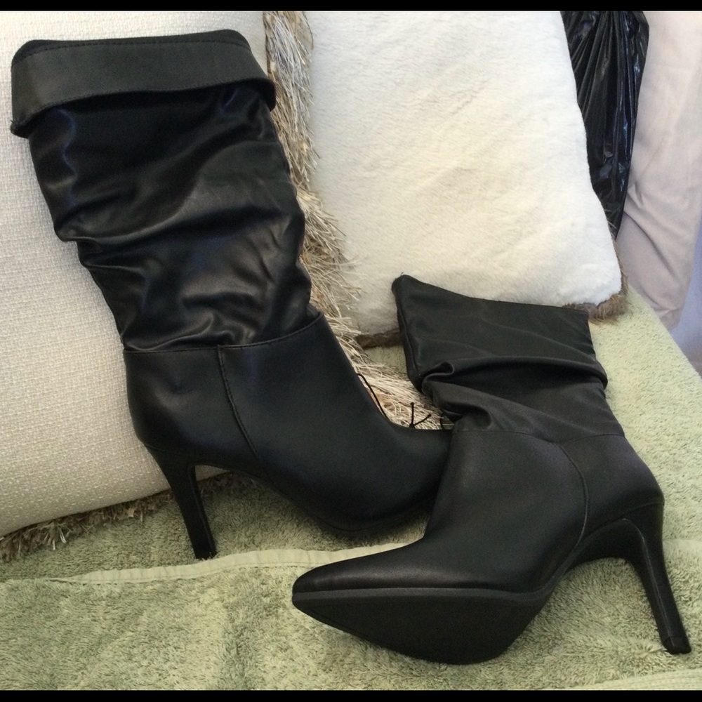 Brand new Black boots high heeled
